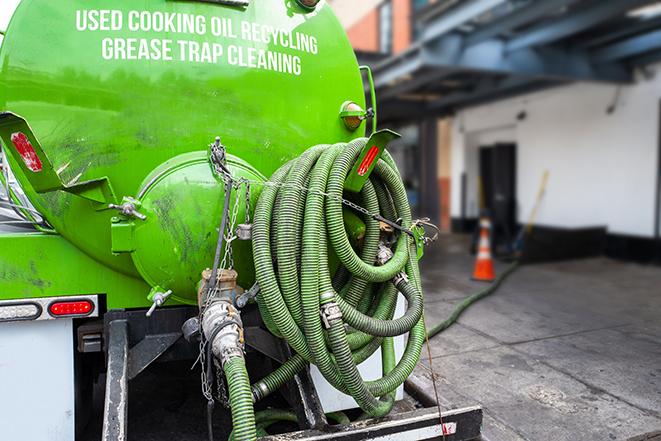 licensed technician pumping a grease trap in Linesville, PA